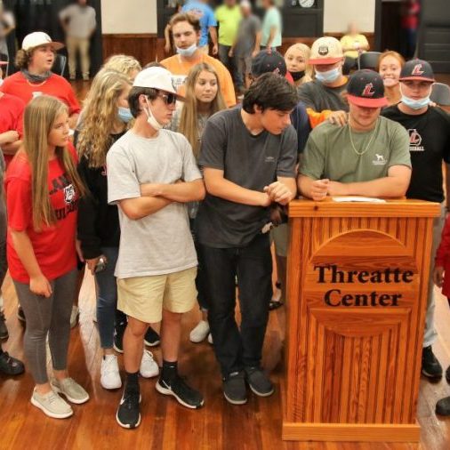 Pictured is Jacob Haircloth and other students who showed up at Monday's school board meeting in support of the current Bulldog baseball coaching staff. 
